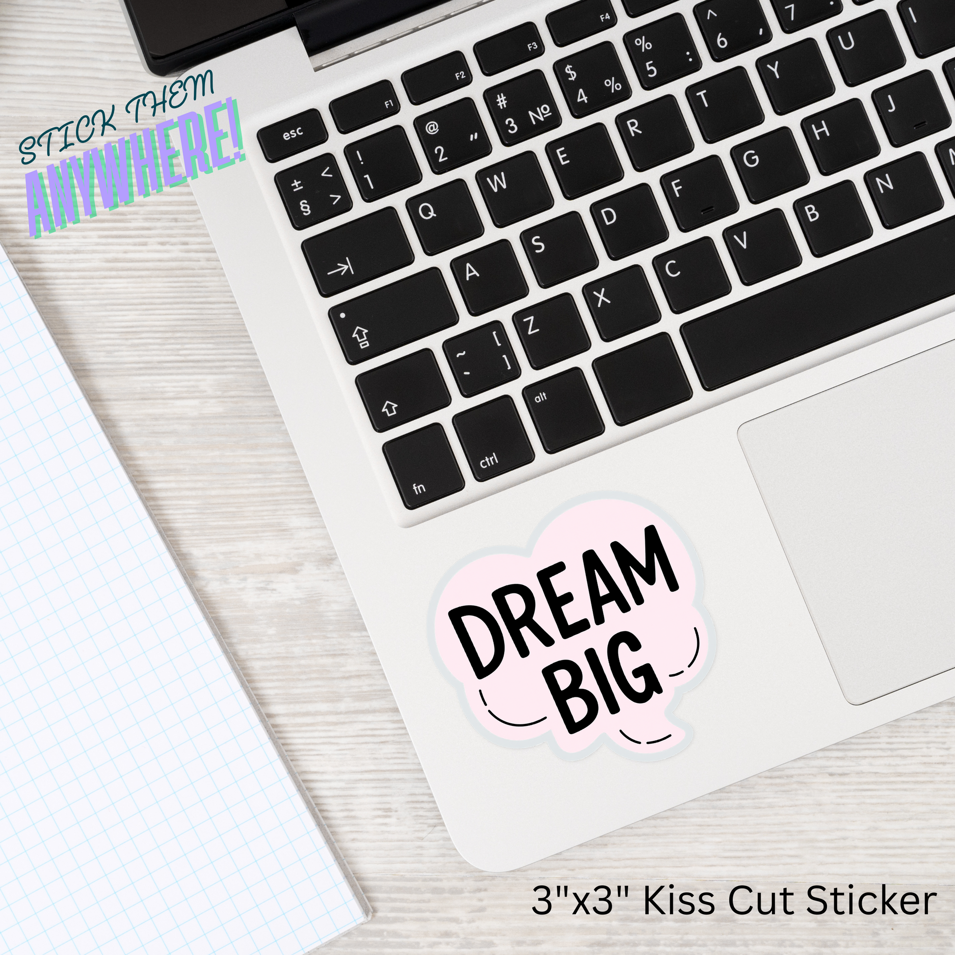 Laptop with motivational 'Dream Big' sticker on the palm rest area, from Chic Prints Club Tier 1, designed to inspire daily.
