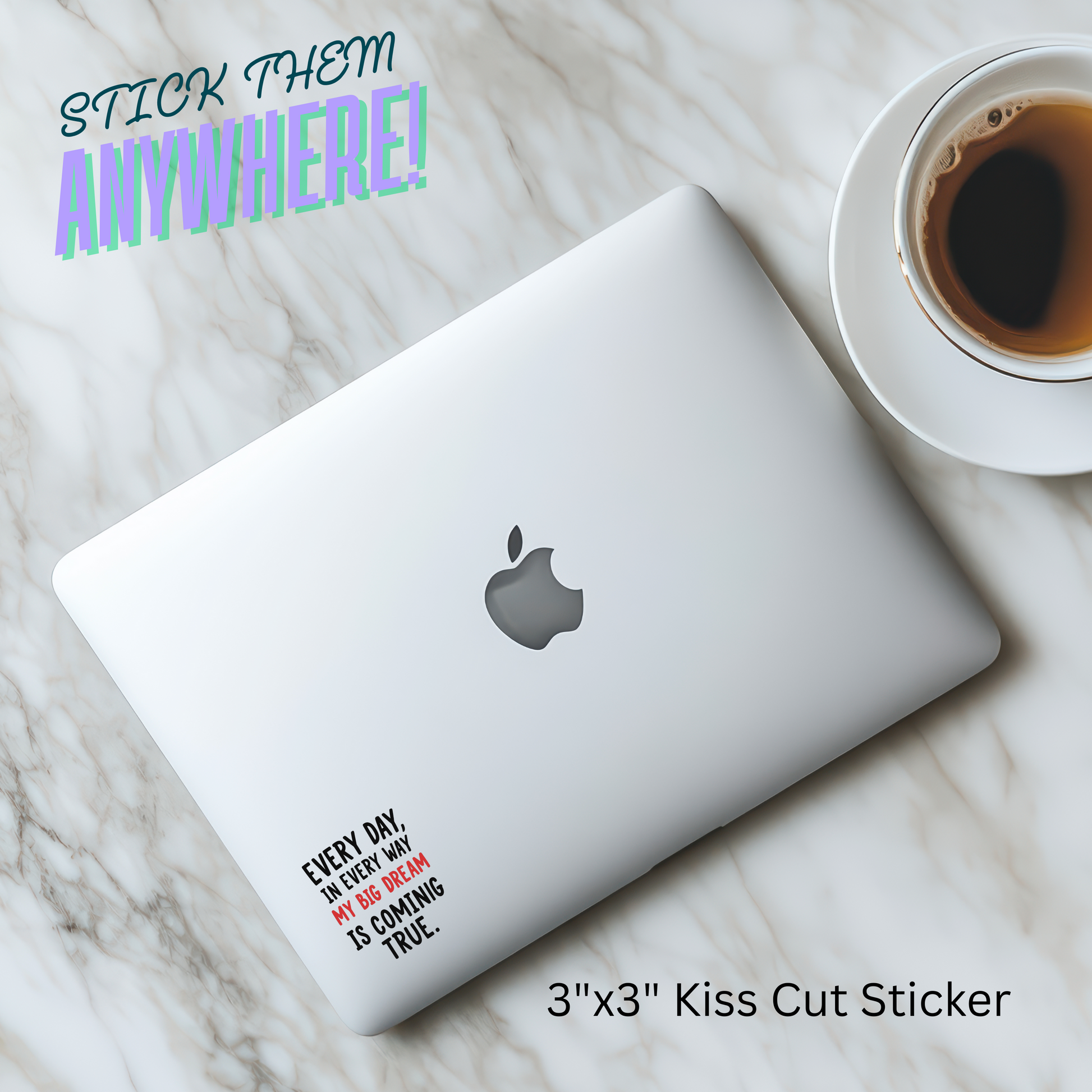 Laptop with a sticker on a marble surface next to a cup of coffee